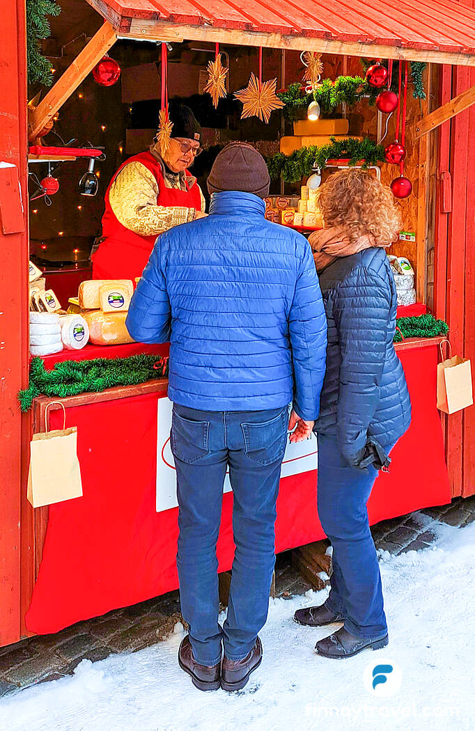 A market stall offering farm-produced cheeses