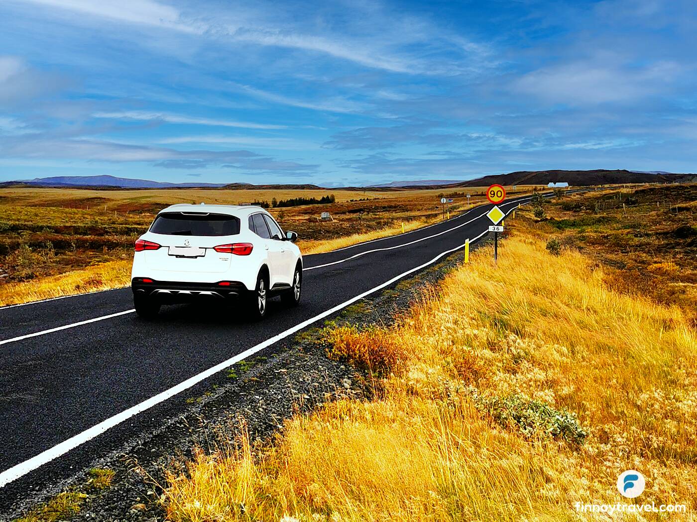 A car driving in Iceland within the 90 km/h zone.