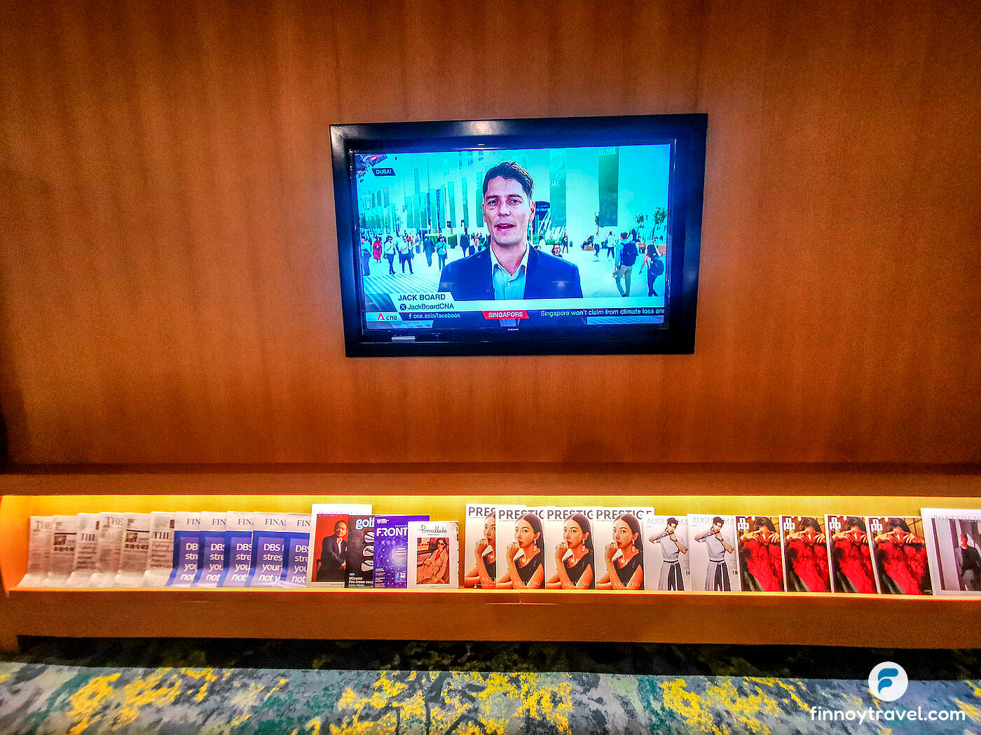 television and magazine rack of Ambassador Transit Lounge