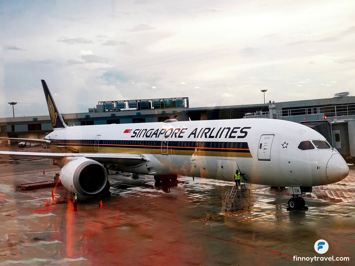 A Boeing B787-1000 aircraft of Singapore Airlines preparing for take-off at Changi International Airport.