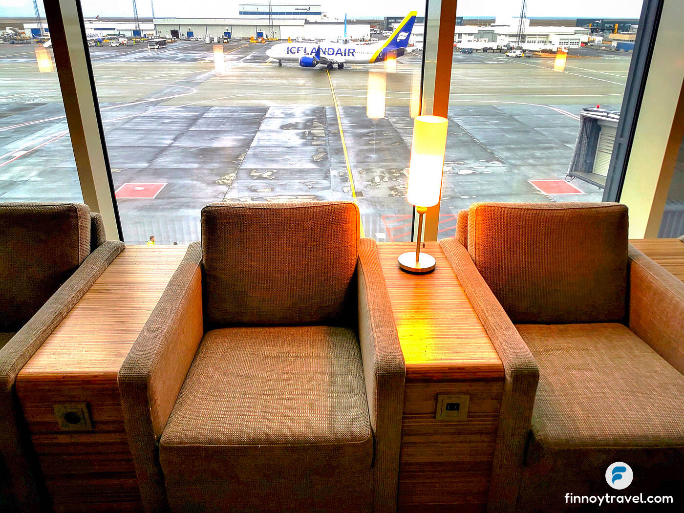 Chairs offering a tarmac view at the Saga Lounge in Reykjavik Airport